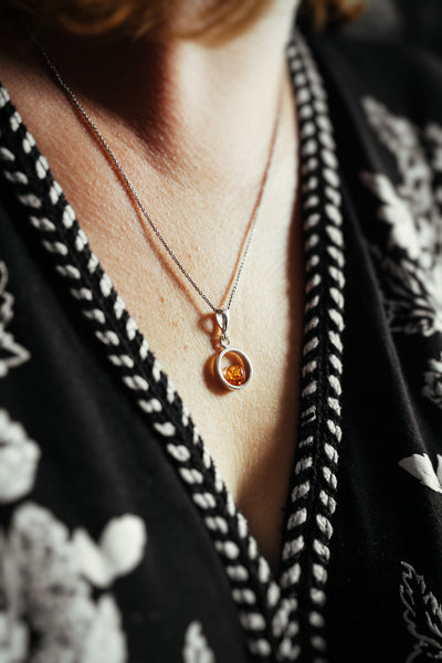 Circle of Radiance - Minimalist Silver Pendant with Baltic Amber