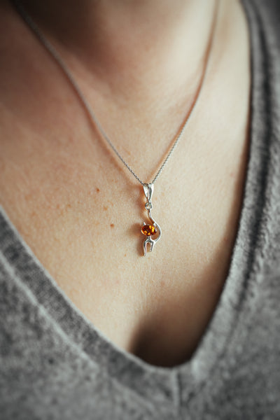 Feline Elegance - Silver Cat Pendant with Baltic Amber