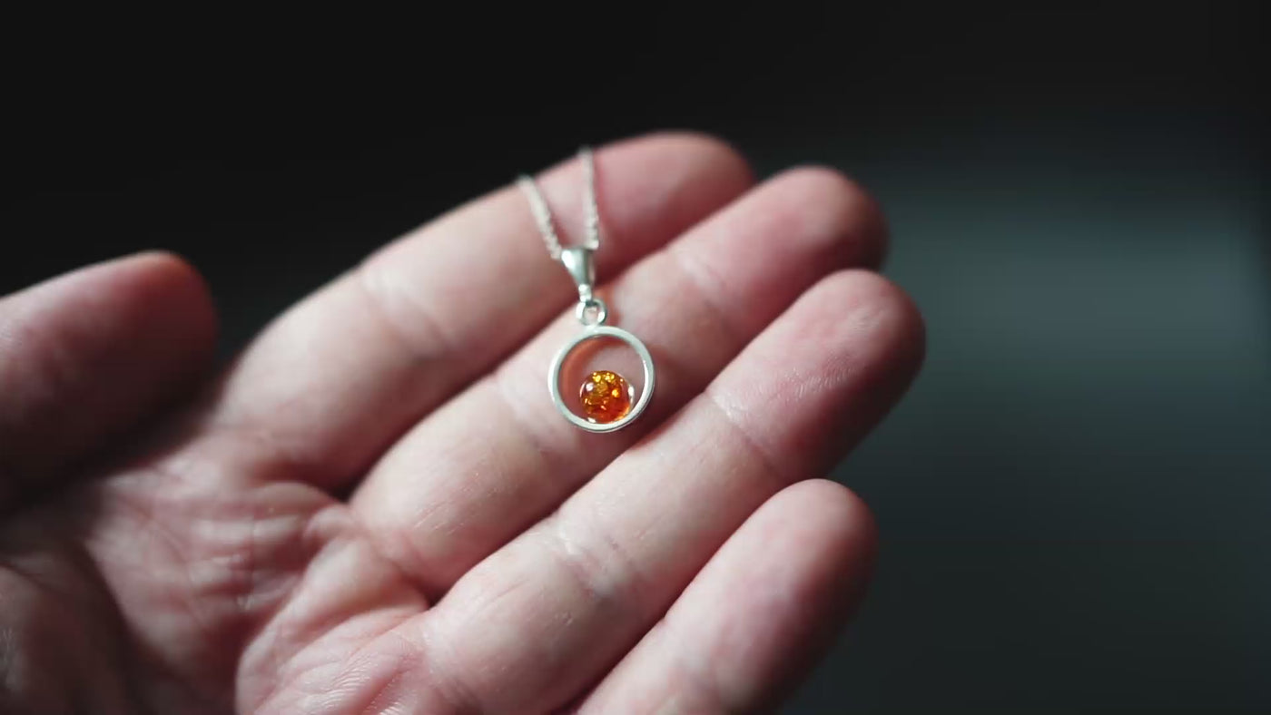 Circle of Radiance - Minimalist Silver Pendant with Baltic Amber